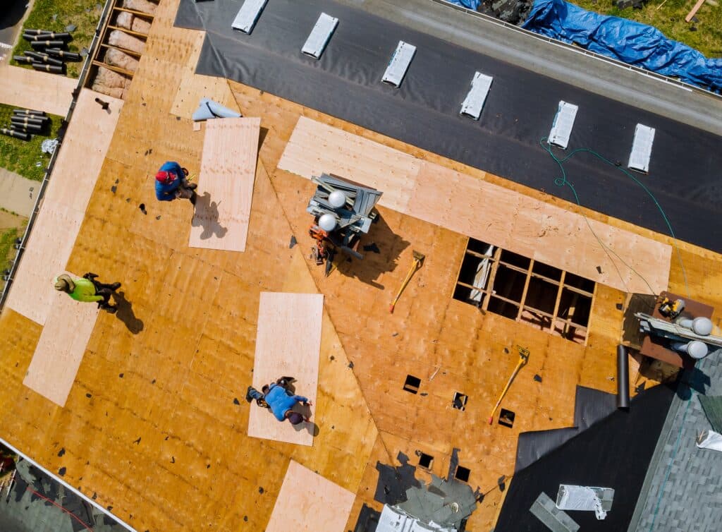 Removal old roof replacement with new shingles of an apartment building