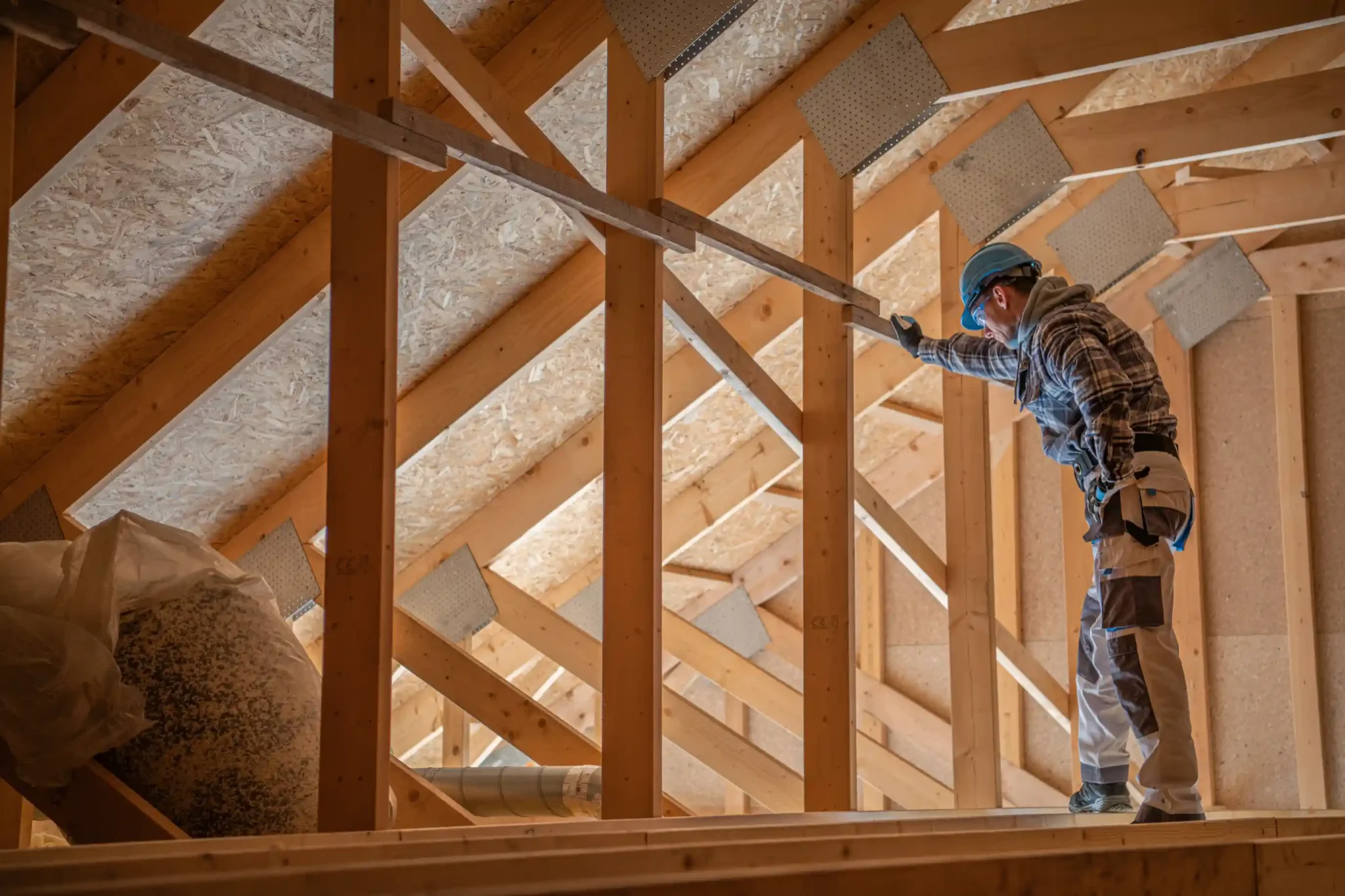 worker inspecting finished insulation installment